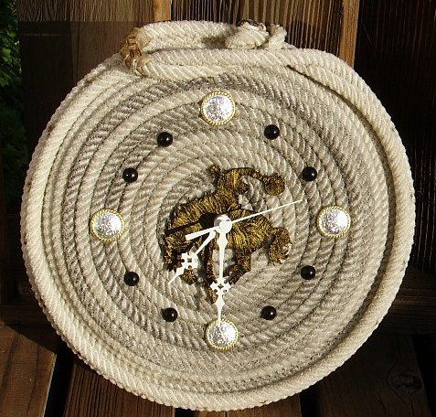 a clock made out of rope on top of a wooden table