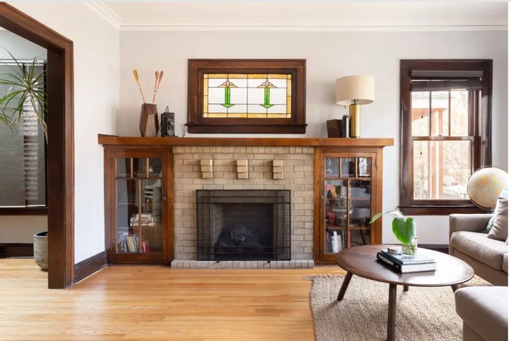 a living room filled with furniture and a fire place