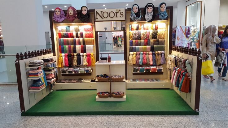 a store with lots of colorful items on display in the middle of a mall floor