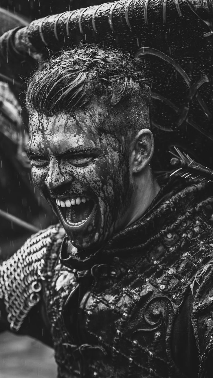 black and white photograph of a man with mud on his face holding an umbrella over his head