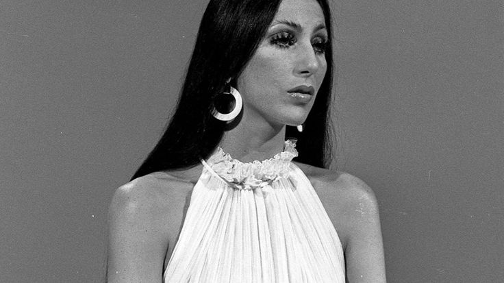 black and white photograph of a woman with large hoop earrings