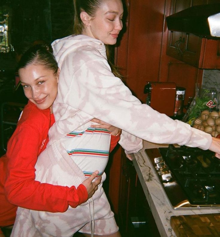 two women are in the kitchen preparing food