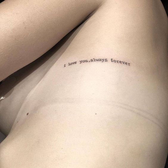 a woman's back with the words i love you always forever written on it