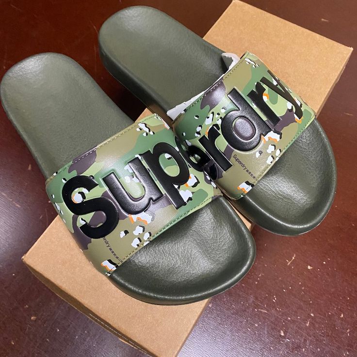 Superdry Mf300004a Slip On Slide Sandals Sz Small Brand: Superdry Department: Men Size: Small Color: Camo Green Type: Sandals Style: Slide Style Code: Mf300004a Pattern: Camouflage Theme: Classic Closure: Slip On Features: Comfort, Lightweight Occasion: Casual Seasons: All Seasons Condition: New With Box I Offer Discounts For All Return Customers. - Jvs Green Slip-on Slides For Outdoor, Green Outdoor Slip-on Slides, Green Synthetic Slides For Outdoor, Sporty Green Slides For Outdoor, Green Non-slip Slides For Outdoor, Green Round Toe Slides For Outdoor, Casual Green Sandals For Streetwear, Sporty Outdoor Slides With Flat Shape, Green Synthetic Sandals For Streetwear