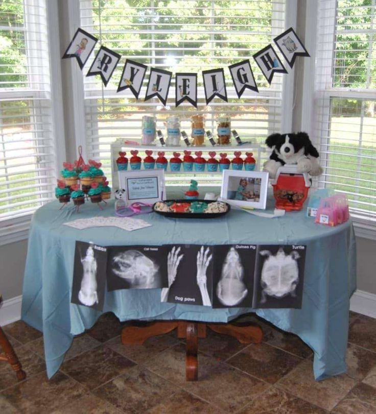 a baby shower table with diaper images and pictures on it, including an x - ray