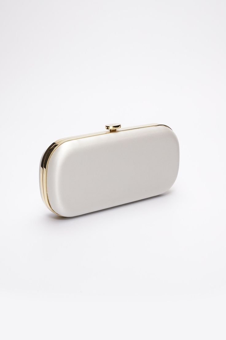 The Ivory Bella Clutch, as seen on VOGUE, is a classic and ultra-feminine bridal handbag, crafted with the finest duchess satin in Florence, Italy. A dreamy bridal clutch bag, the Ivory Bella Clutch is soft and elegant, crafted to elevate your wedding day look. Whether styling your designer clutch for your wedding bag or gifting it to your bridesmaids for their bridesmaid bag, know that this tasteful bespoke clutch will only enhance a classic aesthetic. The Ivory Bella Clutch will also complemen Sophie Bush, Bridal Clutch Bag, Wedding Wardrobe, Bridal Handbags, Custom Handbags, Heirloom Wedding, Bridal Accessory, Bridesmaid Bags, Engraved Plaque