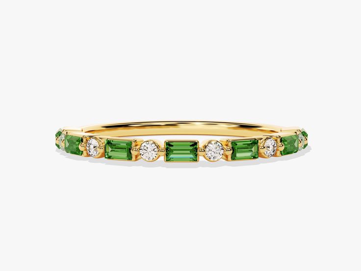 This ring is a wearable oasis, a celebration of life's continuous cycle, and a captivating expression of individuality. Baguette-cut emeralds, each symbolizing rebirth and vitality, are nestled among round-cut diamonds. Green Baguette Cut Stackable Rings, Timeless Green Jewelry With Baguette Diamonds, Green Emerald Stackable Ring With Baguette Cut, Green Baguette Cut Stackable Emerald Ring, Emerald Ring In 14k Yellow Gold With Baguette Diamonds, Emerald Ring With Baguette Diamonds In 14k Yellow Gold, 14k Gold Jewelry With Green Baguette Diamonds, Green 14k Gold Jewelry With Baguette Diamonds, Precious Rings