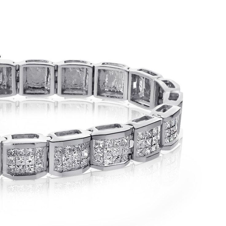 "14K White Gold 5.00 ct Princess Cut Diamond Bracelet 7\" long . This elegant 14K white gold 7-inch diamond bracelet showcases 144 princess cut diamonds of 5.00 carat (total carat weight). The invisible setting gives it a rich look by which you are sure to receive compliments. For more information, contact Avital & Co Jewelry at (212) 764-6851 DIAMOND SPECIFICATION Diamond Shape (Cut)Princess Diamond Carat5.00 carat (total carat weight) Diamond ColorG,H Diamond ClaritySI1 Diamond SettingInvi Luxury Diamond White Diamond Bracelet For Anniversary, Luxury Diamond White Bracelet For Anniversary, Platinum Diamond Bracelet With Baguette Cut, Formal Diamond White Diamond Bracelet With Pave Setting, Anniversary Platinum Tennis Bracelet With Pave Setting, Anniversary Tennis Bracelet With Pave Setting In Platinum, Anniversary White Gold Tennis Bracelet With Pave Setting, Platinum Diamond Bracelet With Pave Setting, White Gold Tennis Bracelet With Pave Setting For Wedding