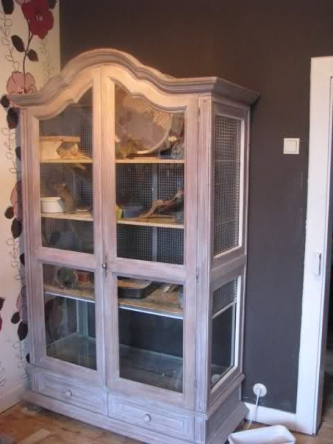 an old china cabinet in the corner of a room