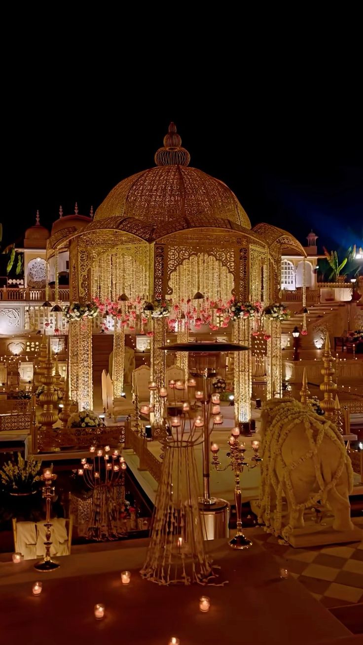 an elaborately decorated building with candles lit up