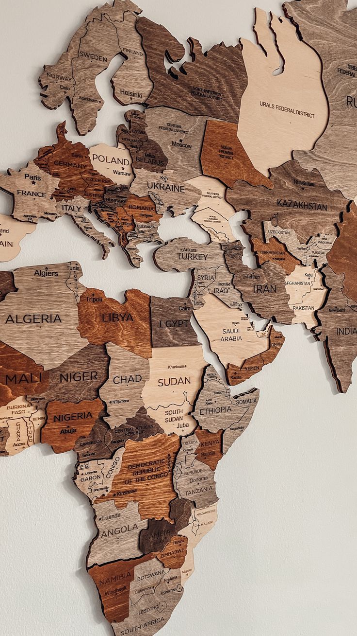 a wooden map of the world with countries