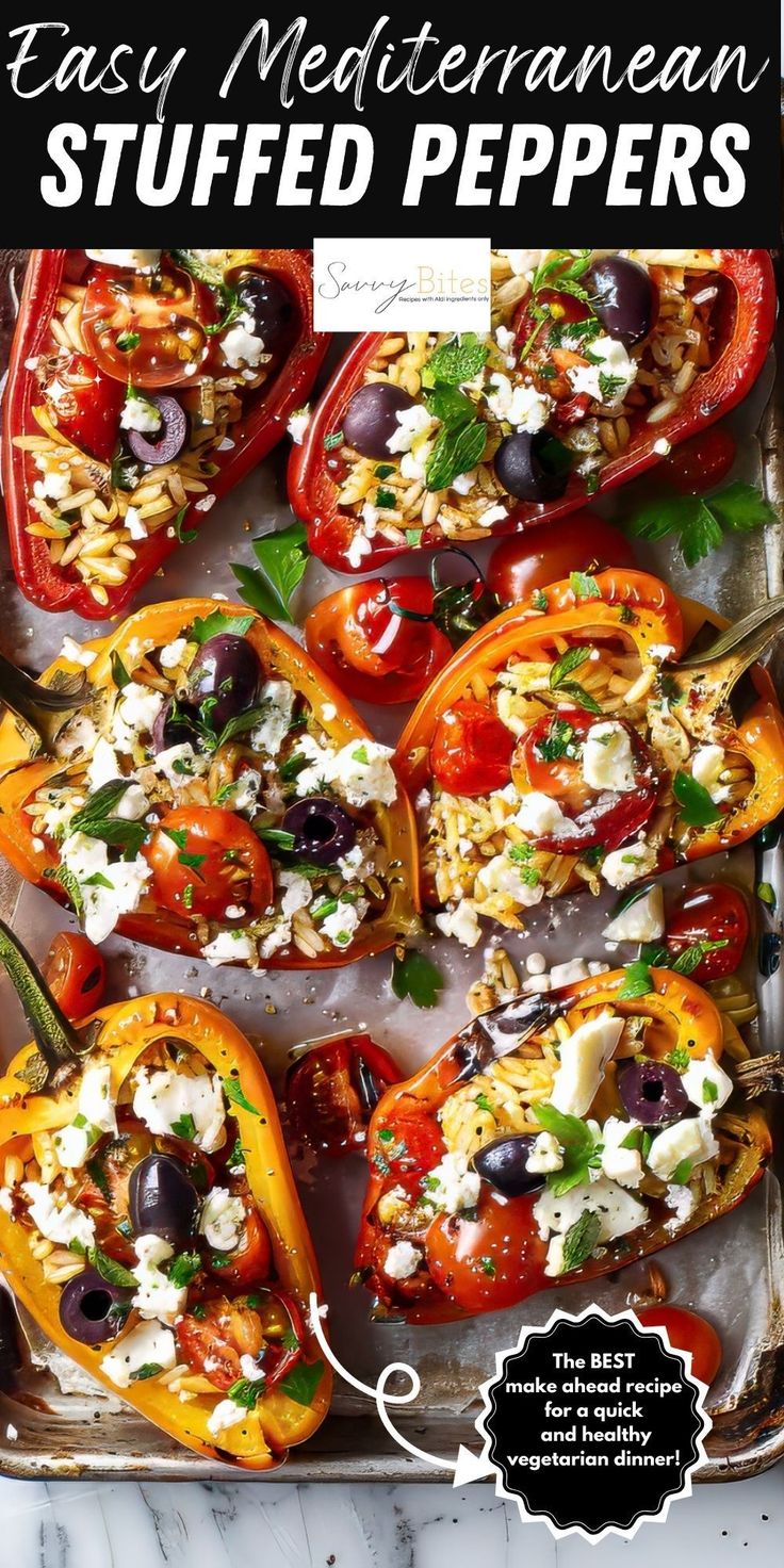 stuffed bell peppers with feta cheese and olives in them on a baking sheet