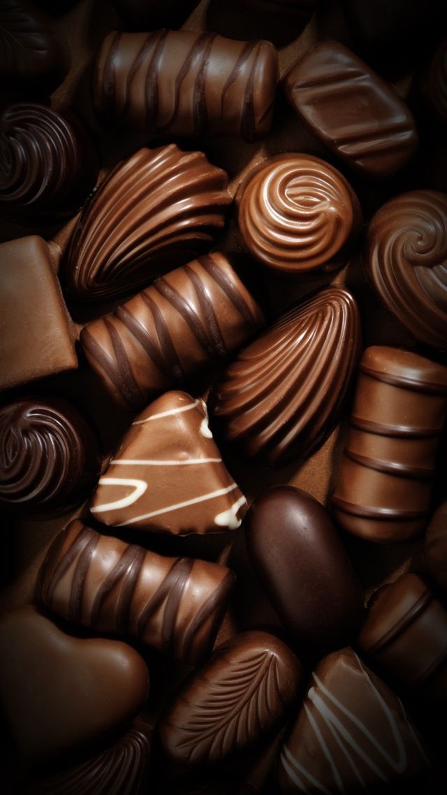 many chocolate hearts are shown together