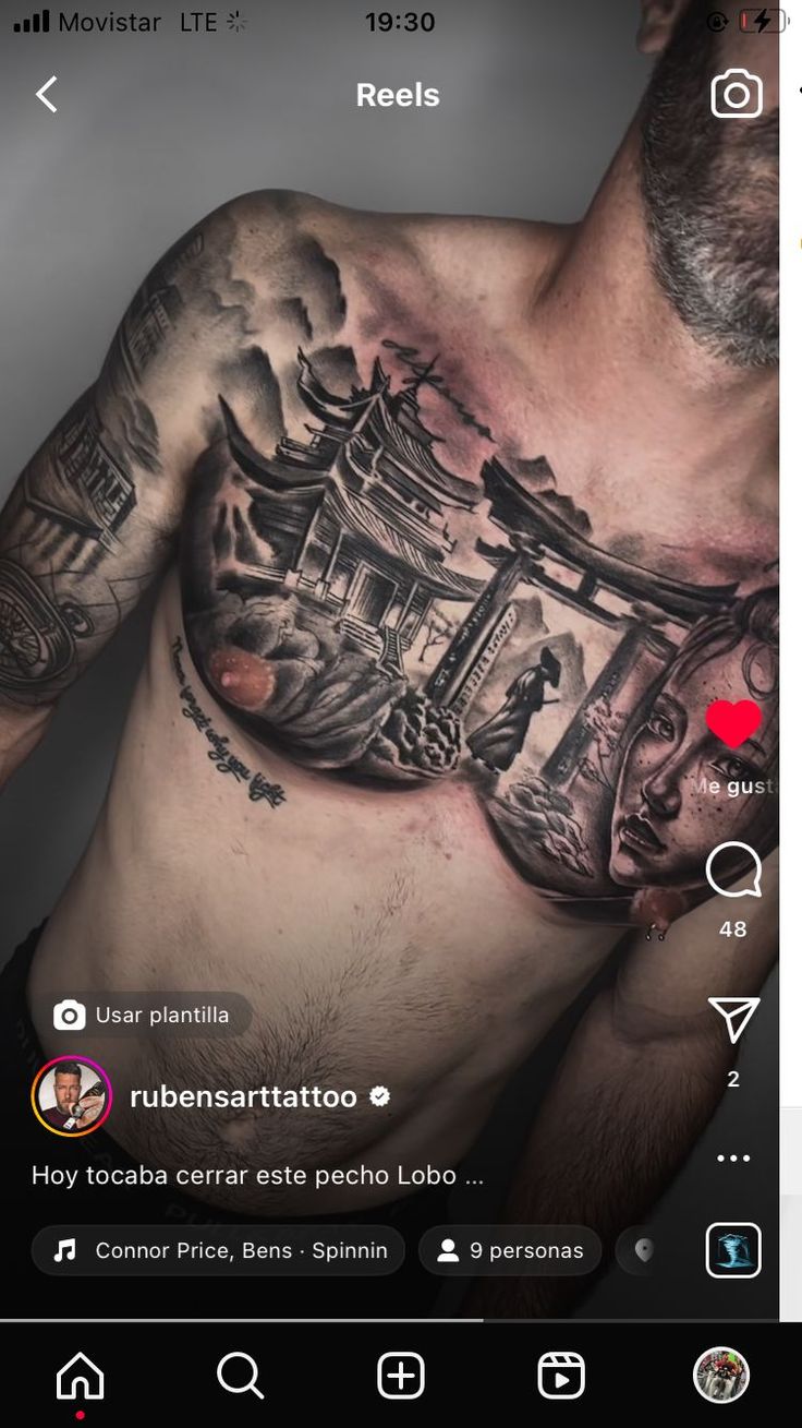 an image of a man with tattoos on his chest