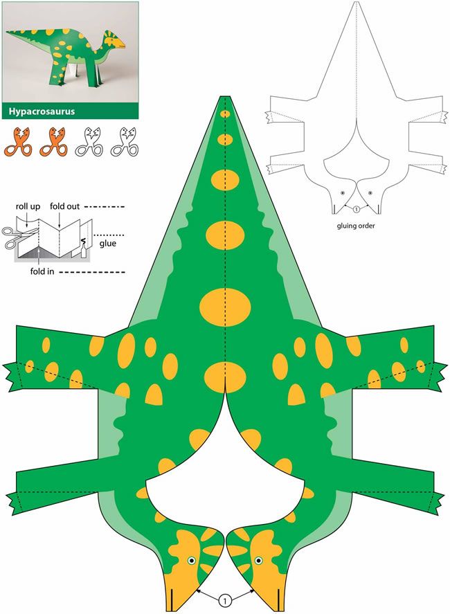 an origami model of a green dinosaur with yellow spots