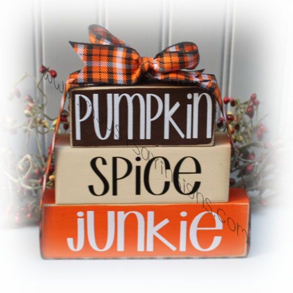 "Pumpkin Spice Junkie Itty Bitty Wood Blocks I know a spice junkie or two, do you? They wait all year for the season to come rolling around to get their \"fix\". Cute set of my itty bitty blocks or that special person. Blocks have been painted brown/cream/burnt orange. Edges have been sanded for a worn, distressed finish. Lettering is done in white and black vinyl. A coordinating ribbon has been tied around the stacked blocks. Measures 4½x6\" stacked together." Stacked Blocks, Crafty Hobbies, Wood Block Crafts, Halloween Wood Crafts, Tiered Tray Diy, Christmas Craft Fair, Handmade Wood Signs, Block Craft, Wood Book