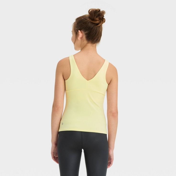 Why we're ALL IN: Solid-color athletic tank top with flat seams keeps them comfortable during any activity. Crafted from recycled polyester with spandex and a UPF 50+ rating to keep them feeling cool and fresh and shield them from the sun. Tailored in a fitted, below-hip length hip with a V-neck front and back for a sporty vibe. All in Motion™: Made for every move, priced for every day. All In Motion, Fabric Tape, Hip Length, Body Measurements, Upf 50, Girls Shopping, Athletic Tank Tops, Shoe Laces, The Sun