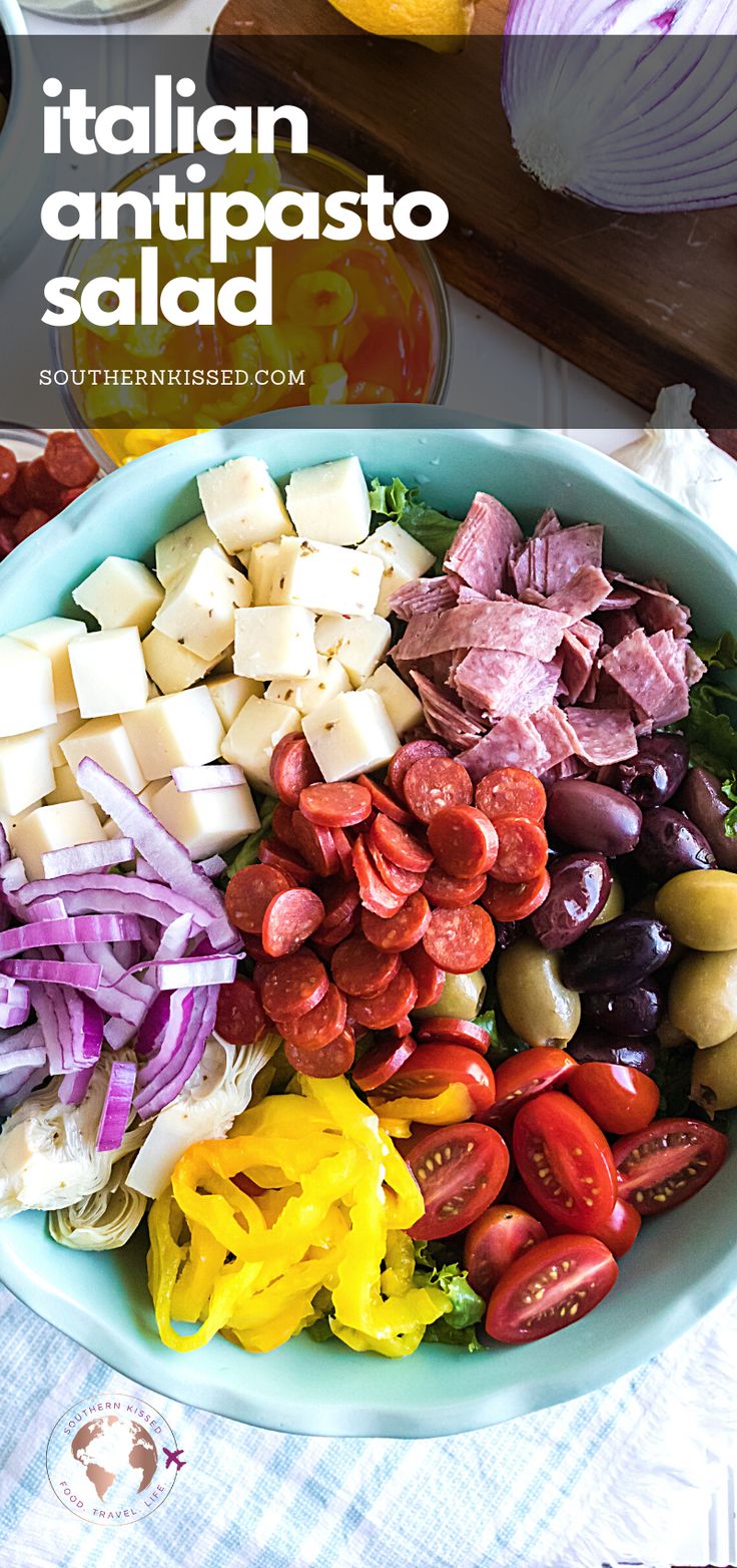 a bowl filled with lots of different types of food on top of a white table