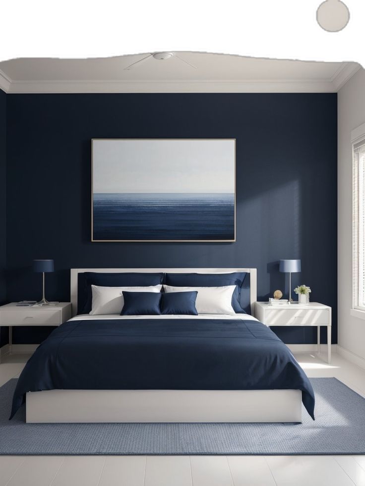 a blue and white bedroom with a large painting on the wall above the headboard