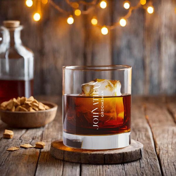 a glass filled with liquid sitting on top of a wooden table