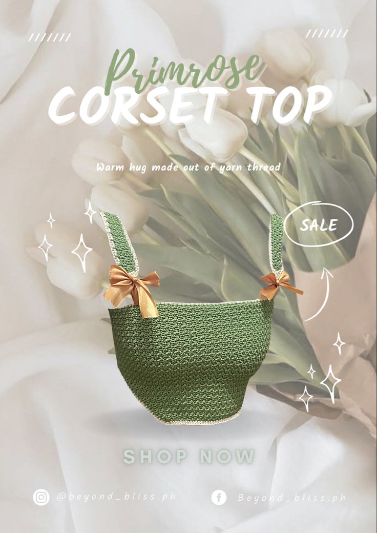 a green purse sitting on top of a white bed next to tulips and stars