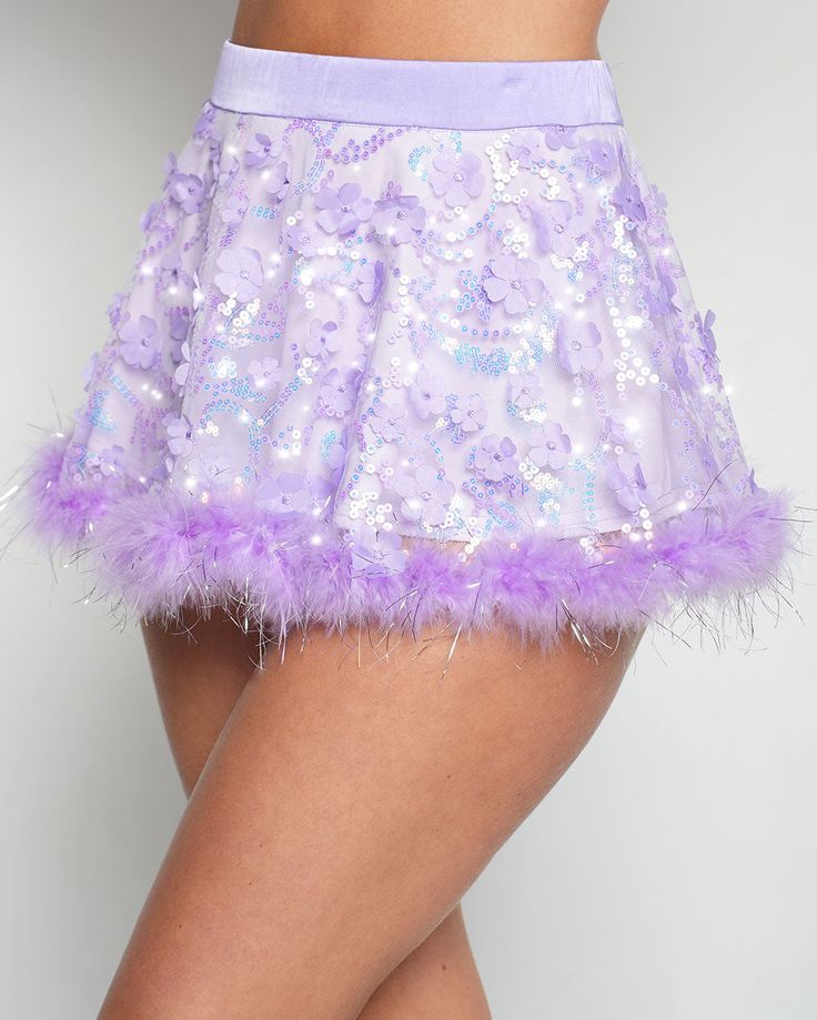 Your wishes are granted with the Genie Dust Floral Sequin Marabou Skirt! Crafted from a stunning purple fabric adorned with shimmering floral sequins and tinsel marabou hem, this magical skirt is your portal to a dreamy fairy tale adventure. 100% Nylon Hand wash cold Thick waistband Purple Sequined Party Skirt, Fitted Purple Sequin Skirt, Purple Lined Party Skirt, Purple Lined Skirt For Party, Summer Party Bottoms With Feather Trim, Fitted Purple Party Skirt, Fitted Purple Mini Skirt For Party, Fitted Purple Skirt For Party, Purple Party Bottoms For Spring