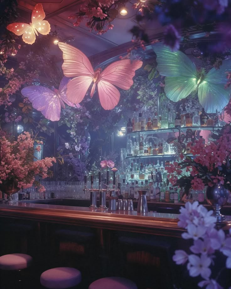 there are many butterflies hanging from the ceiling above the bar area in this restaurant, and it is decorated with flowers