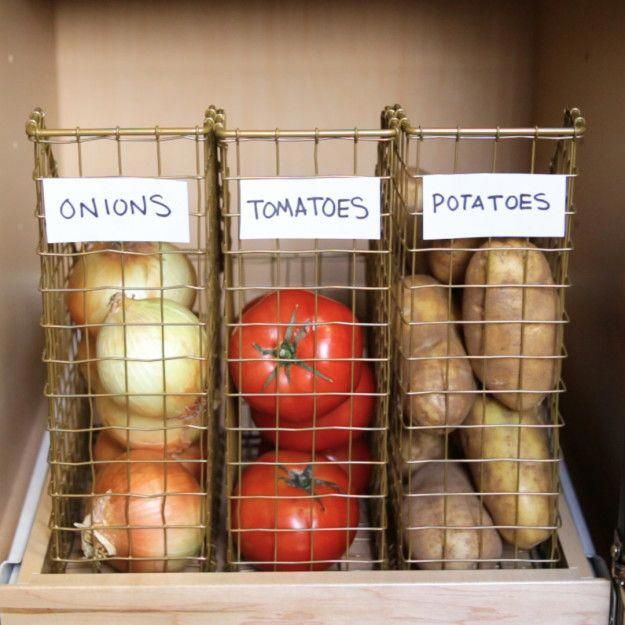 tomatoes, potatoes and onions are in baskets on the shelf