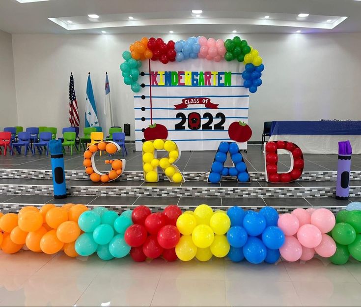 balloons are arranged in the shape of letters spelling out the word's name and date