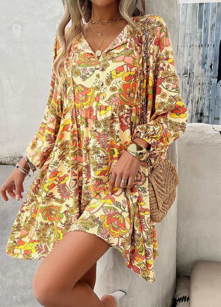 Our Athena floral mini dress is perfect for unleashing your inner bohemian goddess. With its unique floral design and playful silhouette, you'll feel like you're dancing in a field of flowers. The Athena dress is the perfect blend of comfort, style, and fun. Size Guide: Model is 5’65” tall, and has a 33.2” bust, 26.4” waist, & 35.2” hips. She is wearing a S / US 4 / AU 8. This dress is true to size. Material: 100% Rayon. Feature: Mini length. V-Neckline. 3/4 Puff Sleeves. Floral Print. Relaxed fit. Maternity Friendly. Care Instructions: Machine wash / Cold hand wash Hippie V-neck Mini Dress For Spring, Flowy Floral Print Mini Dress, Beach Floral Print Mini Dress With Long Sleeves, Beach Floral Print Long Sleeve Mini Dress, Long Sleeve Floral Print Beach Mini Dress, Long Sleeve Floral Beach Mini Dress, Floral Print Tunic Mini Dress For Beach, Floral Print Multicolor Mini Dress, Flowy Mini Boho Dress With Print