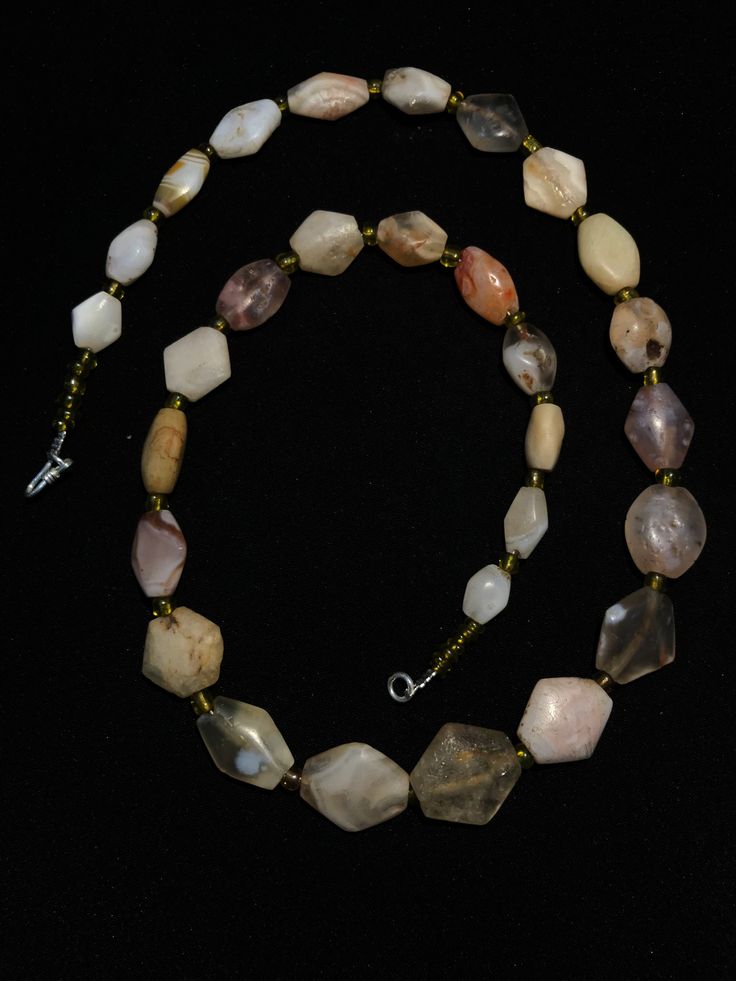 A beautiful string of Bended white agate natural found from Afghanistan dating 1800 yrs. They are found at that time in Afghanistan mostly but also some found in India and Pakistan too. They were used as a special charm jewellery by the affluents at that time period. Beautiful counter bronze are decorated further in between the beads. Spiritual Tumbled Gemstone Beads Jewelry, Vintage Amber Agate Jewelry, Hand-strung Agate Beads As Gift, Vintage Agate Jewelry With Polished Beads, Hand-strung Agate Beads For Gifts, Carnelian Amulet Jewelry With Round Beads, Spiritual Tumbled Agate Jewelry, Vintage Gemstone Beads Jewelry For Healing, Vintage White Gemstone Beads Jewelry