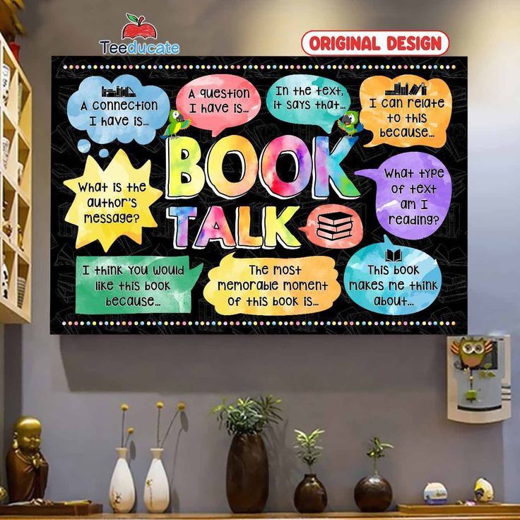 a book talk poster hanging on the wall above a table with vases and books