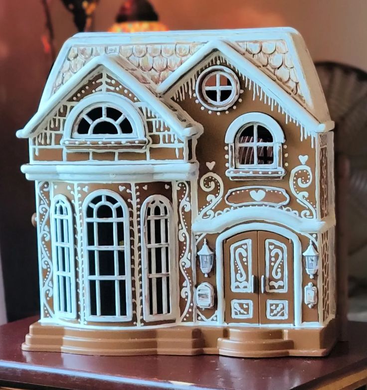 a close up of a toy house on a table