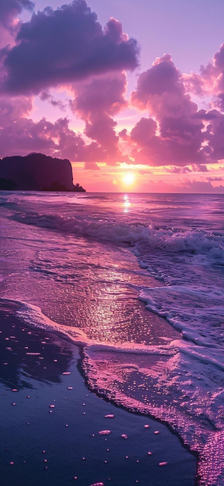 the sun is setting over the ocean with clouds in the sky and waves on the beach