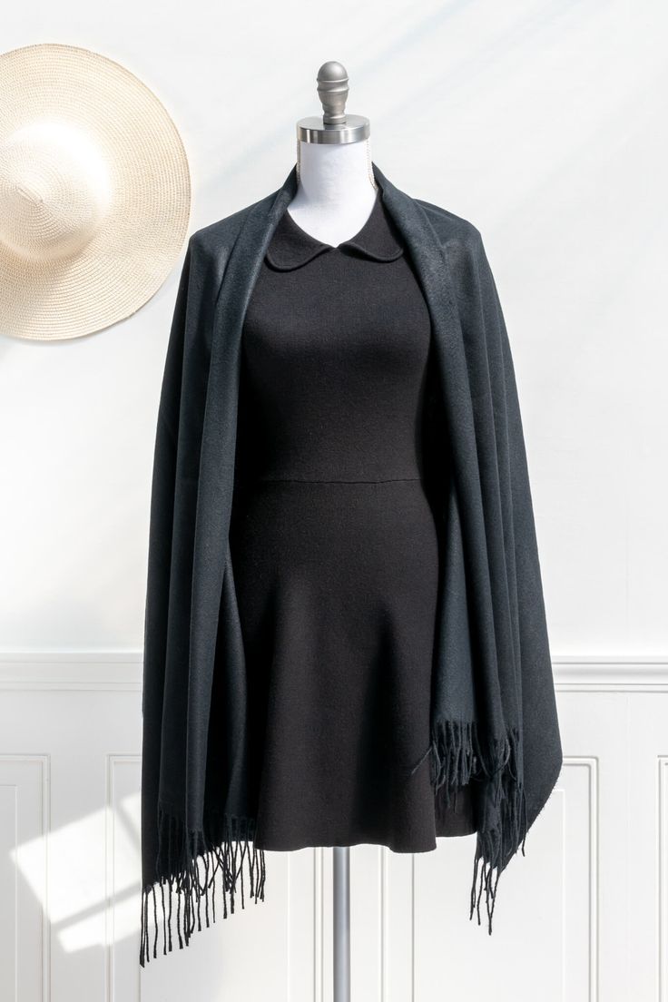 A must-have addition to your cold weather wardrobe, this simple-yet-chic scarf in a classic black cashmere feel will keep you cozy and stylish all season long. Please Note- This item is final sale only. . Details: 27" Wide x 71" Long 100% Polyester Imported Solid Cashmere Shawl For Winter, Chic Black Scarves For Winter, Chic Black Scarf For Winter, Chic Black Winter Scarves, Chic Black Winter Scarf, Winter Cashmere Shawl, Black Shawl Scarf For Winter, Classic Solid Color Winter Shawl, Black Shawl For Winter