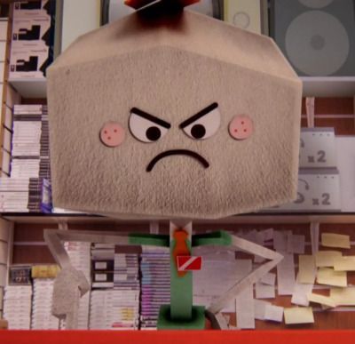 an angry face is on top of a shelf