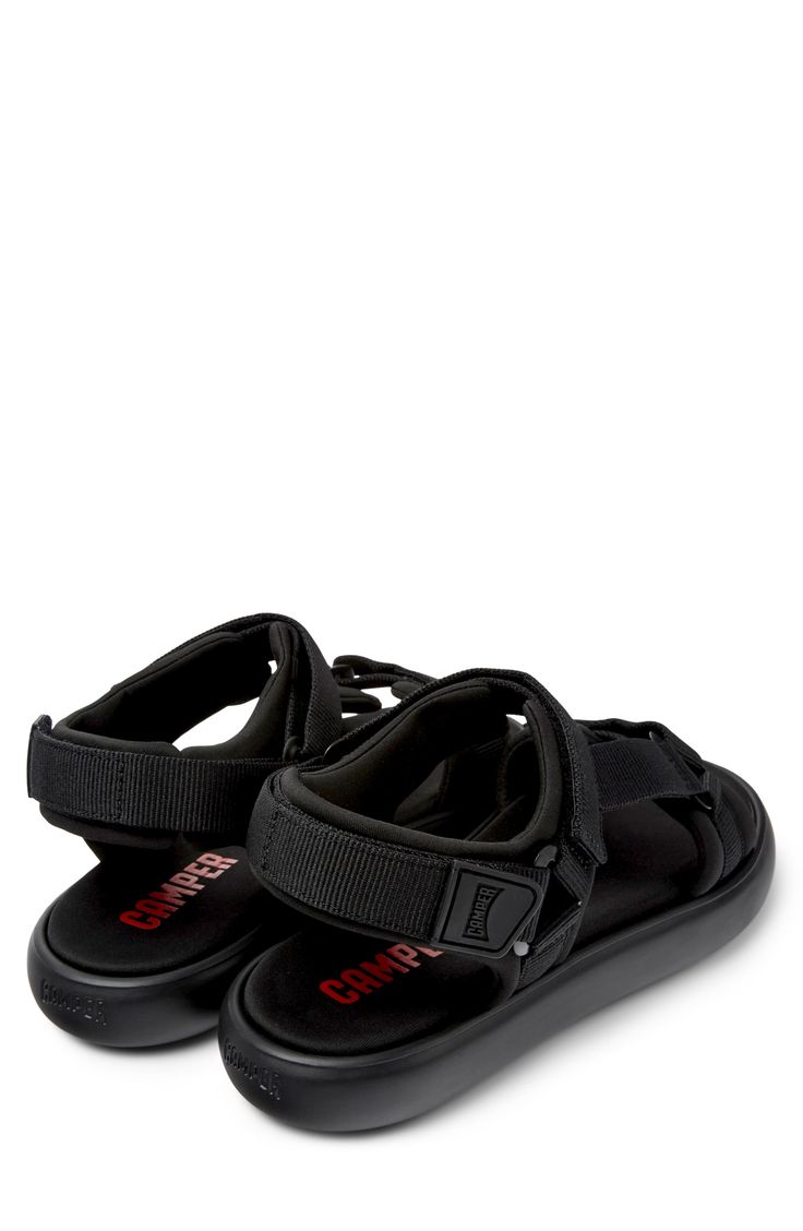 Triple adjustable straps perfect the fit of this sporty sandal set on a cushioned XL EXTRALIGHT® sole for flexible, shock-absorbing comfort. Adjustable hook-and-loop straps Cushioned footbed Recycled-polyester upper and lining/synthetic sole Imported Sporty Adjustable Slides With Removable Insole, Modern Black Slingback Sport Sandals, Modern Outdoor Sandals With Removable Insole, Black Adjustable Functional Sandals, Black Cushioned Footbed Sandals For Outdoor, Lightweight Black Sandals For Outdoor, Black Double Strap Synthetic Sport Sandals, Black Synthetic Double Strap Sport Sandals, Sporty Synthetic Sandals With Ankle Strap