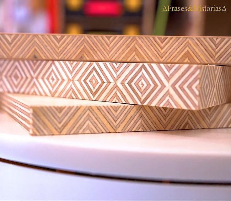 two wooden boxes sitting on top of a table