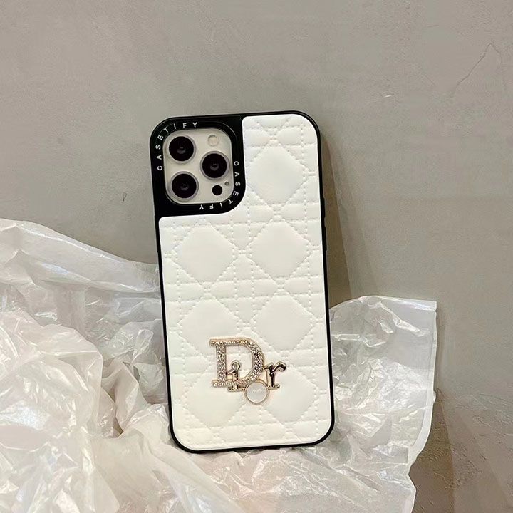 an iphone case with the letter d on it is sitting on top of some plastic