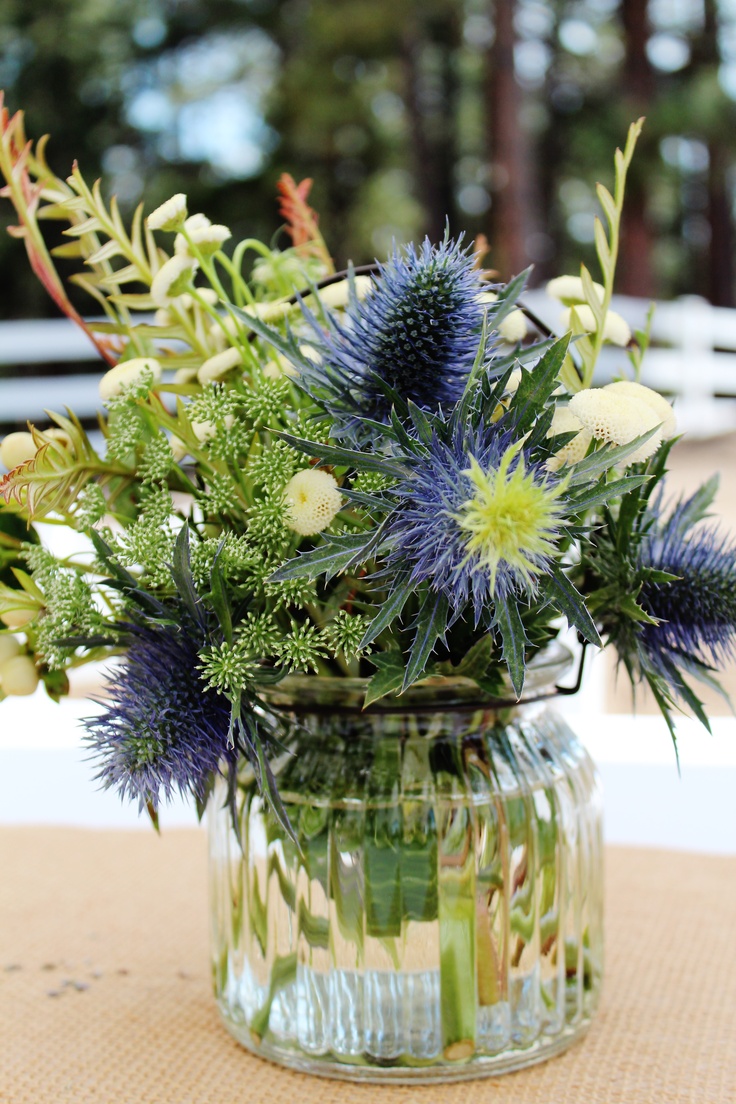 a vase filled with flowers sitting on top of a table