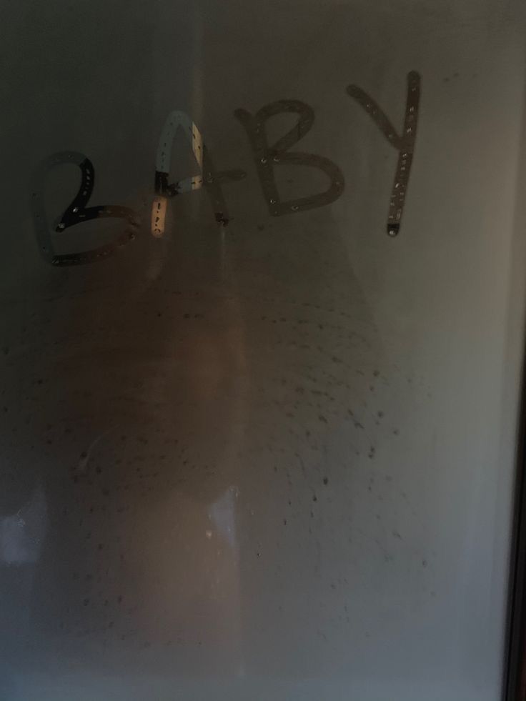 a glass door with the word baby written on it