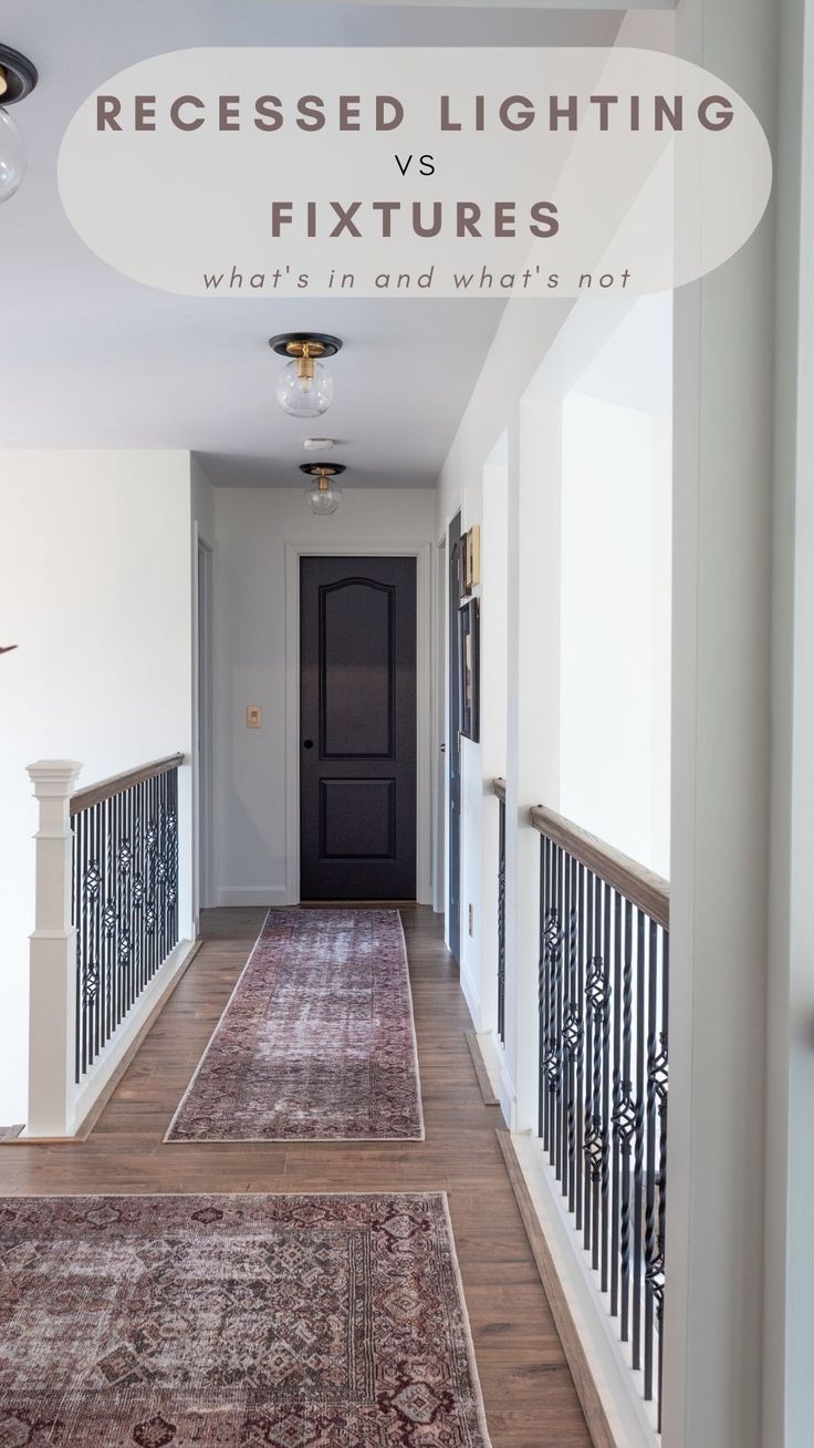 a long hallway with an area rug on the floor