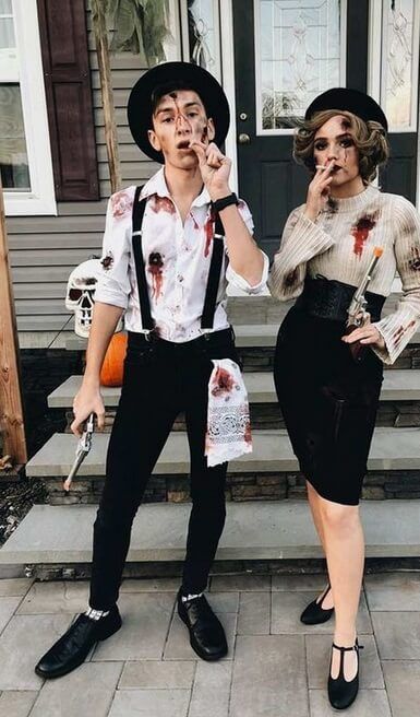 two people dressed up as zombies for halloween