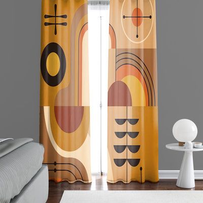 the curtains in this bedroom are designed to look like abstract art and have geometric shapes on them