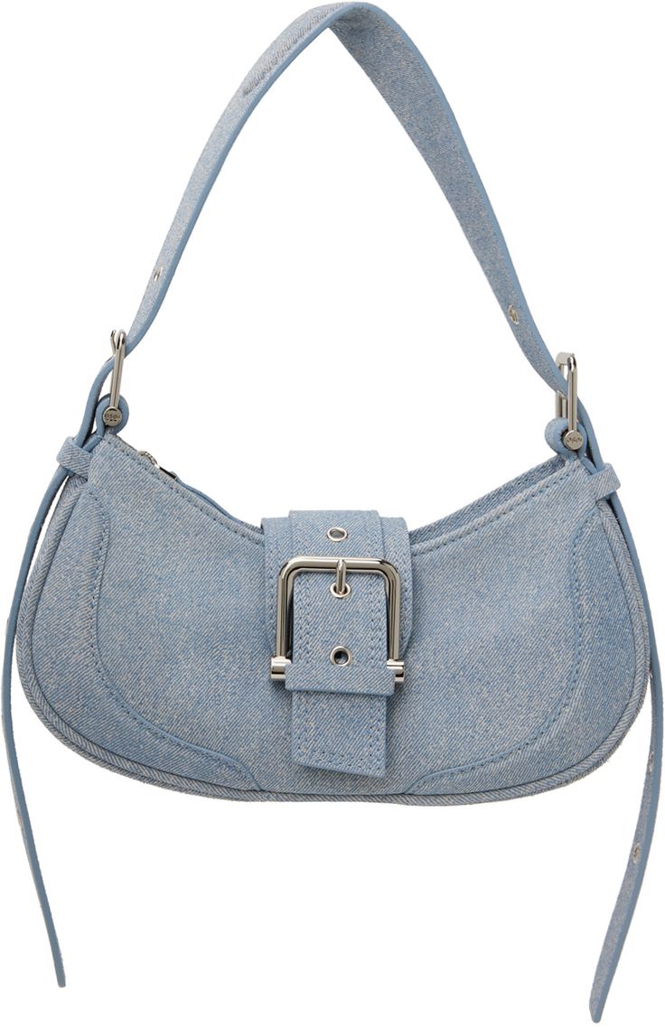 Suede shoulder bag in blue. · Trompe-l'œil graphic throughout · Adjustable and detachable padded shoulder strap · Pin-buckle detailing at magnetic press-stud tab · Zip closure · Patch pocket at interior · Faux-suede lining · Logo-engraved silver-tone hardware · H5.75 x W11 x D3 Supplier color: New denim sky Blue Shoulder Bag With Adjustable Handle For Evening, Blue Satchel Baguette Bag With Detachable Strap, Blue Baguette Satchel Bag With Detachable Strap, Light Blue Satchel Shoulder Bag With Detachable Strap, Blue Baguette Bag With Detachable Strap For Daily Use, Trendy Blue Top Handle Baguette Bag, Chic Blue Baguette Bag With Adjustable Strap, Blue Crossbody Baguette Bag With Detachable Strap, Blue Satchel With Metal Hardware For Everyday Use