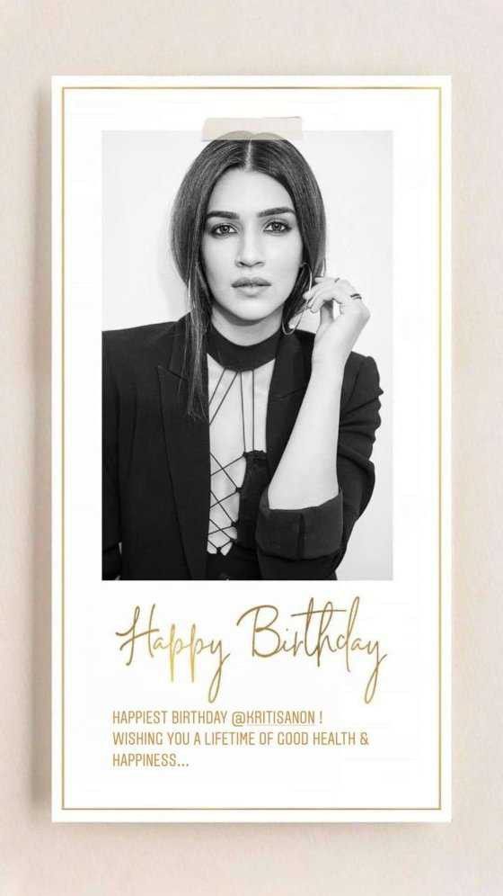 a black and white photo of a woman with her hand on her shoulder, in front of a happy birthday card