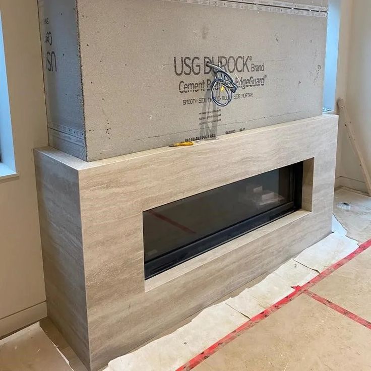 an unfinished fireplace with the usgs block logo on it