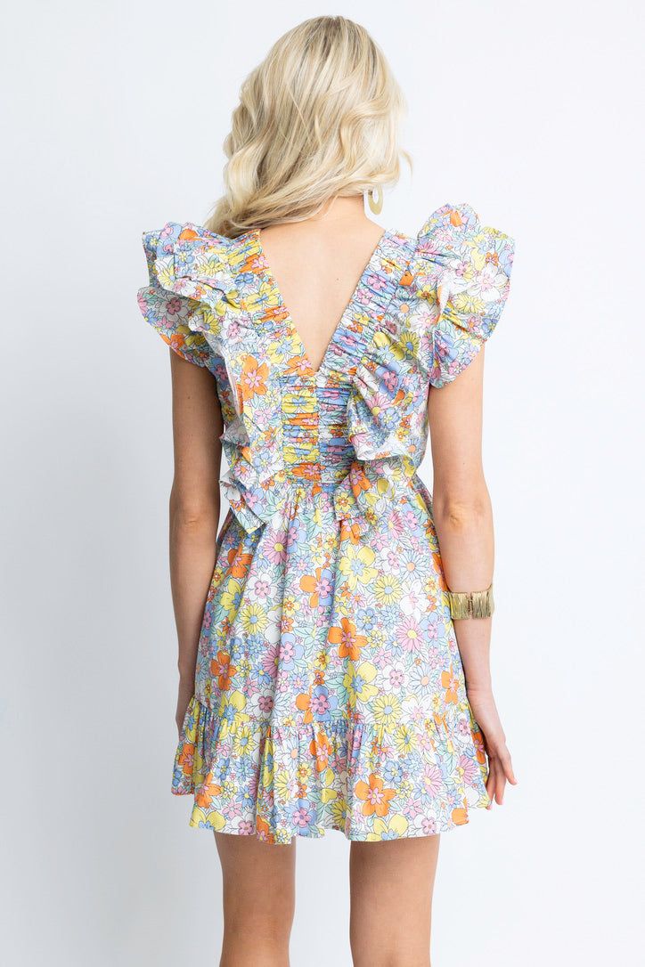 The Floral London Double Vneck Dress features a unique floral London print, complemented by a flattering v-neckline and feminine ruffle details. The fun and easy style makes this dress perfect for any occasion. Summer Floral V-neck Dress With Ruffles, Chic Floral Printed V-neck Dress, Spring V-neck Dress With Smocked Back, V-neck Printed Floral Dress For Garden Party, V-neck Mini Dress With Ditsy Floral Print For Vacation, Spring Vacation V-neck Dress With Flutter Sleeves, Summer V-neck Ruffle Dress For Brunch, Summer Tiered V-neck Dress With Ruffles, Spring V-neck Dress With Ruffle Sleeves For Brunch