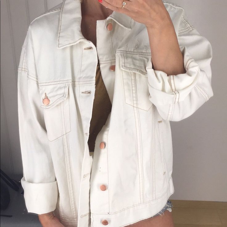 This Off White/Cream Colored Jean Jacket Is Really Something. I Was Going To Keep It For Myself But I Have Too Many Jean Jackets! It’s A Real Beauty! The Gold/Bronze Buttons Just Make It That More Beautiful! I Love The Oversized Fit! This Jacket Also Has These Hidden Pockets On The Inside! *Free People Logo Is Upside Down Inside Of Jacket *Also Seems To Be A Small Ink Mark On The Inside (Not Noticeable At All, See Pics) White Button-up Denim Jacket For Day Out, White Button-up Denim Jacket For Summer, Casual Cream Outerwear With Button Closure, Chic Cream Cotton Outerwear, Casual Cream Button-up Outerwear, Beige Long Sleeve Denim Jacket For Spring, Beige Button-up Denim Jacket For Spring, Cream Spring Outerwear With Pockets, Trendy Beige Denim Jacket For Spring