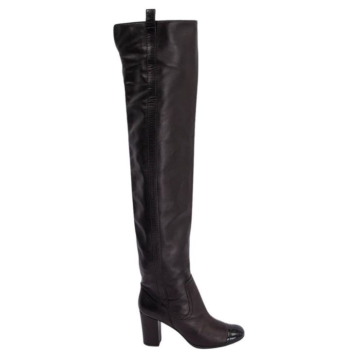 100% authentic Chanel over-knee boots in black smooth lambskin leather with signature patent toe tip. Open with a zipper to a light beige satin lining. Have been worn and show some scuffs along the zipper. Overall in very good condition. Measurements Imprinted Size 37 Shoe Size 37 Inside Sole 24cm (9.4in) Width 7.5cm (2.9in) Heel 8cm (3.1in) Shaft 58cm (22.6in) Top Circumference 35cm (13.7in) All our listings include only the listed item unless otherwise specified in the description above. Designer Black Leather Knee-high Boots, Knee High Chanel Boots, Black Knee-high Boots With Reinforced Heel, Luxury Black Calf Leather Knee-high Boots, Luxury Black Knee-high Boots With Leather Lining, Black High Boots, Block Heel Boots, Chanel Black, Lambskin Leather